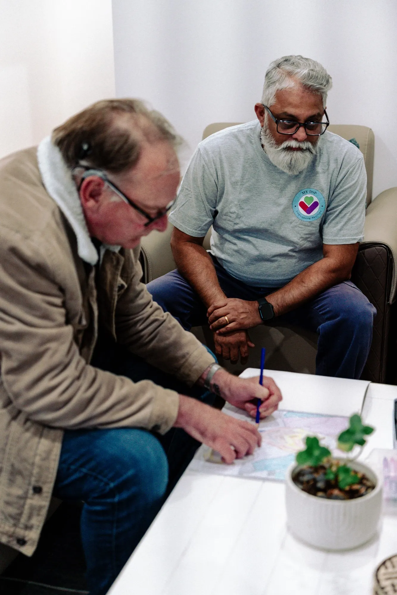 A support coordinator meeting with the MY DSP team